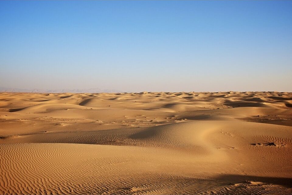 Layered golden sand dunes in the Dubai desert