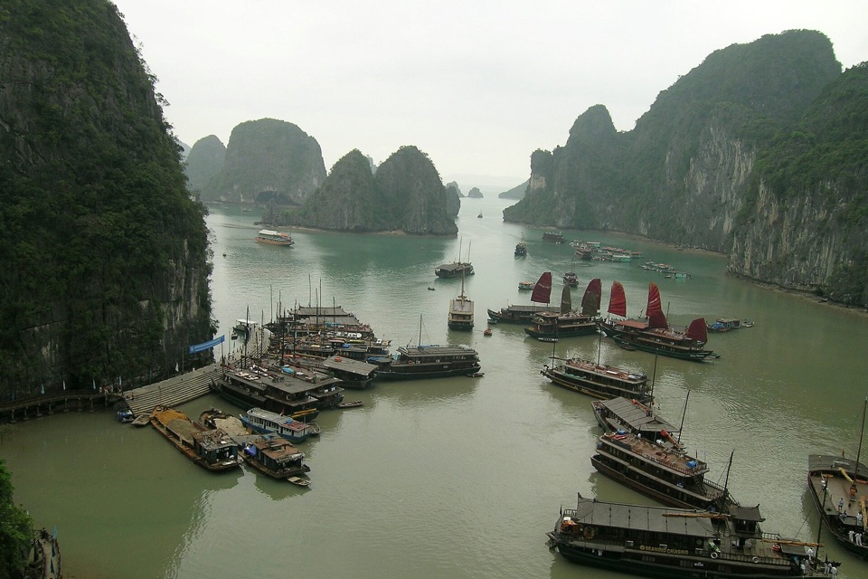 Traditional cruise boats among limestone karsts in Halong Bay, Vietnam