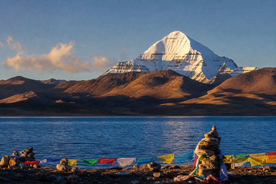 Mount Kailash above the blue waters of Lake Mansarovar in Tibet