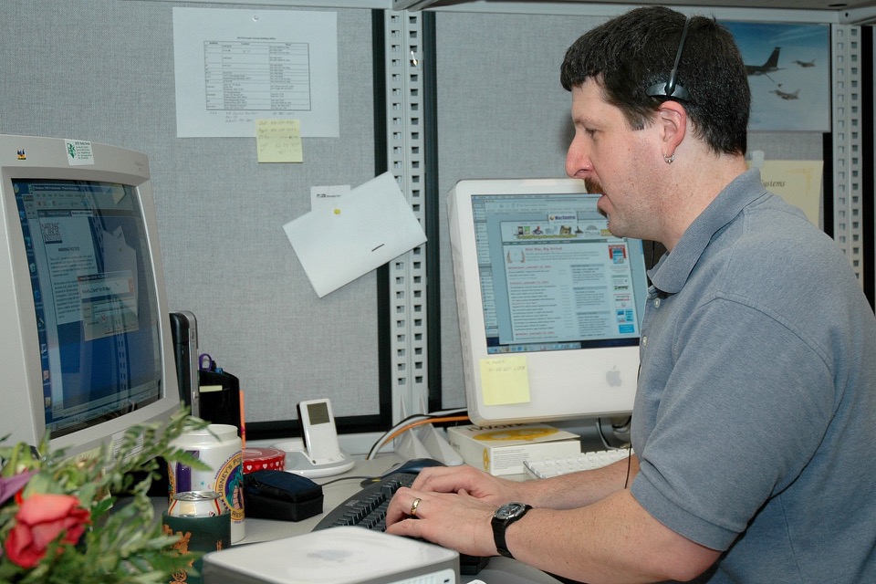 Support specialist wearing a headset while answering a call