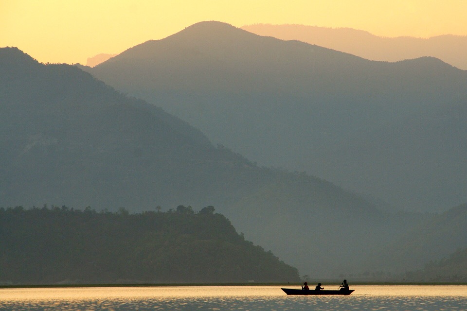 Traditional wooden boat on Phewa Lake in Pokhara