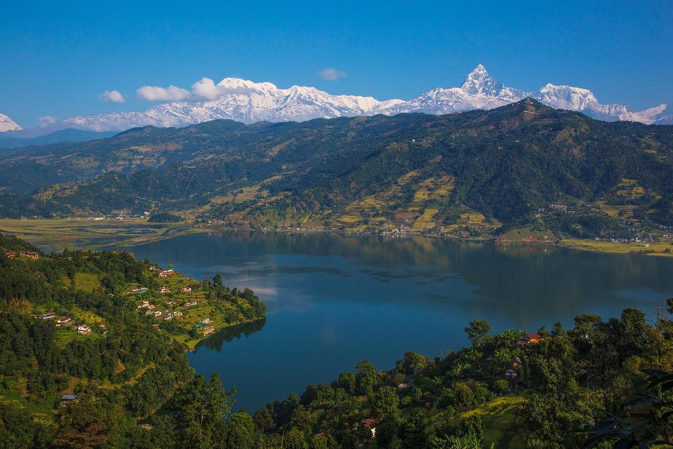 Phewa Lake reflecting the Annapurna and Machhapuchhre mountains in Pokhara