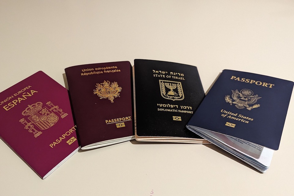 Four biometric passports arranged side by side